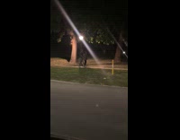 Couple records their park walk with tripod