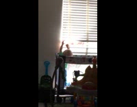 Toddler caught climbing on window blinds