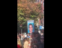 Person displays man ID photo on marathon