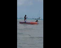 Purple bathing suit large red tube beach 