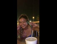 Girl holds phone to ear video call 