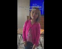 Little girl in pink sings for mom 