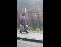 Collab WINY - Woman balancing grocery bag on head 