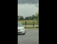 Girl silver shirt parking lot car overcast