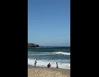 Man white brief kneel touch body pose beach