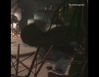 Actor performs a stunt on set, jumps off trampoline onto dinner table with smoke effects