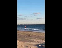 man in blue swim shorts in water New york