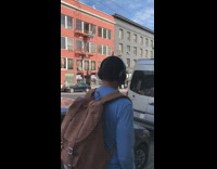 Guy sitting on double yellow line for photo street
