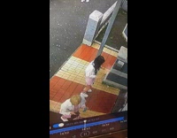 Two girls white coat dance door cctv