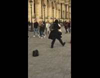 People walk stare at woman red dress