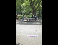 4 guys play game with green ball over table 