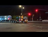 Huge truck transporting train car