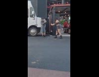 Woman jean outfit poses near food truck