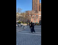 Collab WINY - Man hold large stick branch at park