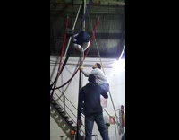 2 guys try to balance on pole 