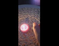 Guy lights lighter red candle brown placemat 