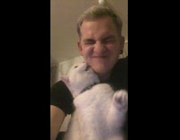 Black shirt guy kisses white cat earrings