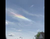 Rainbow colored thin cloud on sky