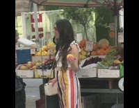 Woman orange fruit swing dance video shoot