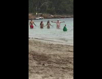 Two guys and girls run dance beach