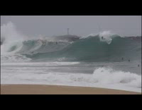 huge wave knocks down surfers 