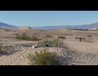 Woman lay sand dunes dessert bushes underwear