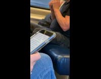 Man across seats files nails with nail filer on metro train
