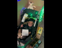 Baby dressed as bodega cat for Halloween