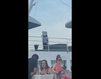 Two men stand middle of spinning ring light camera