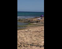 Bikini girl self timer ocean water umbrella 