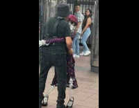 Man dances with skeleton in subway station