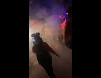 Guy dressed as velma runs towards the light 