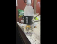 Person taps bottle water turns to ice