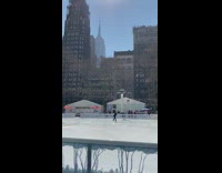 Figure skater ice skates on outdoor rink