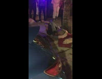 Guy gets into fight in front of club with pants pulled down and shows naked butt