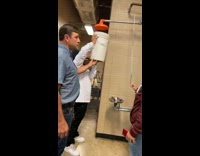 White bucket overflows with water spills