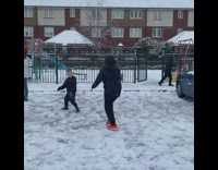 Girl trying to throw snowball falls fail 