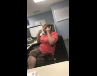 Woman pink shirt office phone gestures