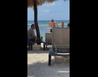 Woman in white and blue bikini workout at the beach