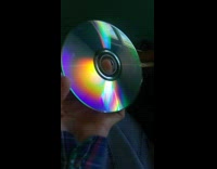 Light hits CD disc creates rainbow flannel 