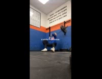 Woman lifting weights falls on her back hitting wall 
