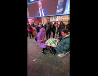 Man wears grimace costume in chess match