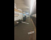 Guy cuts hair at subway station 