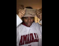 Girl loses hair band trying to put it on 