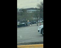 Woman blonde pink bag parking lot photo shoot