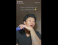 Guy laughs while trying to order food