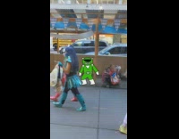 Two girls dressed in power ranger outfit walking on street