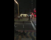 Guy white jacket music video street night