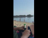 Woman black top bikini hand on head beach photoshoot