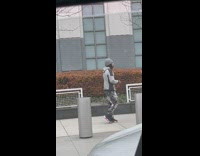 Man holds his pet rat  on the street 